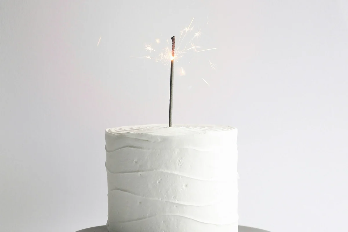 Simple birthday surprise at home with a cake and a lit sparkler