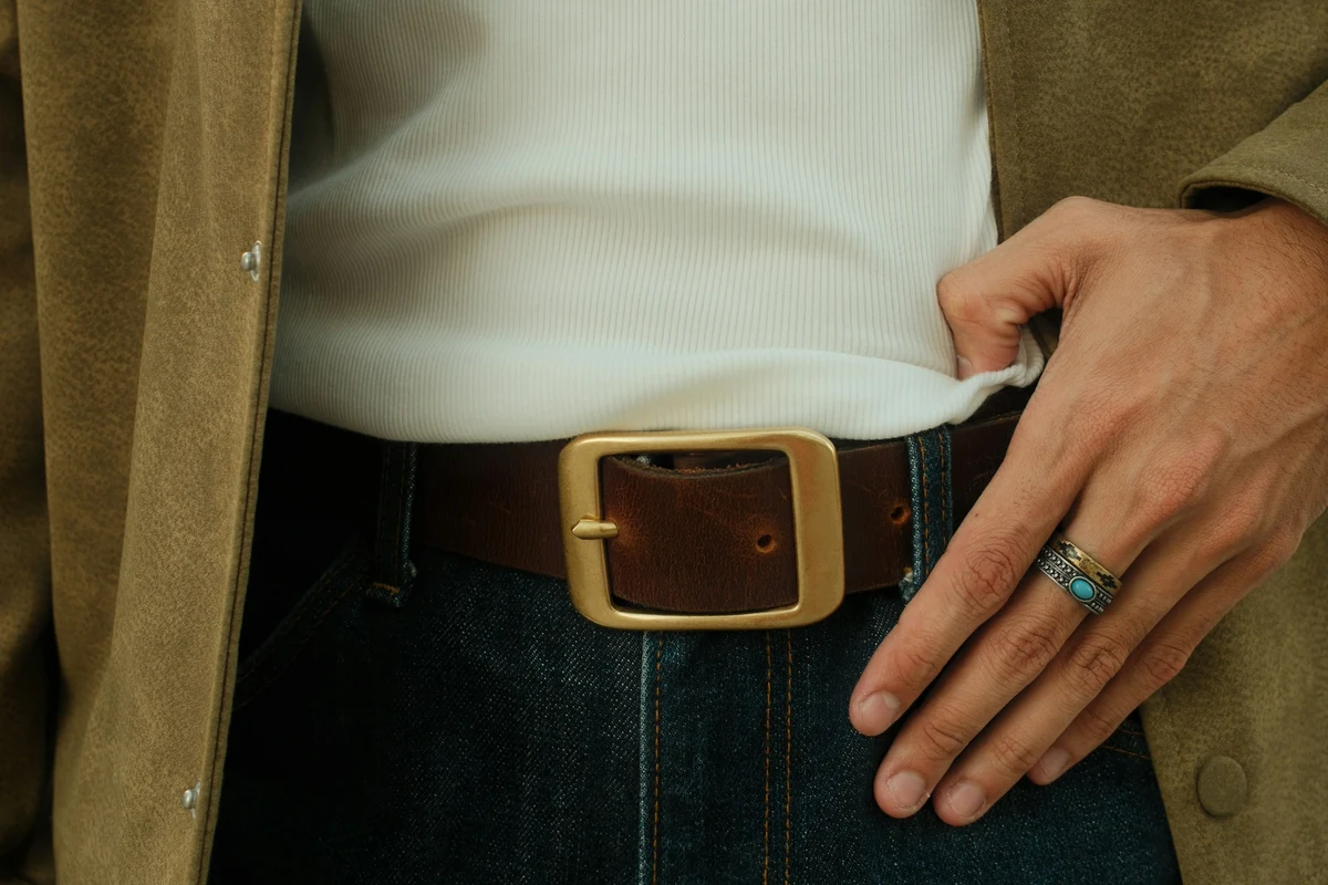 Casual brown leather belt worn with jeans for weekend wear