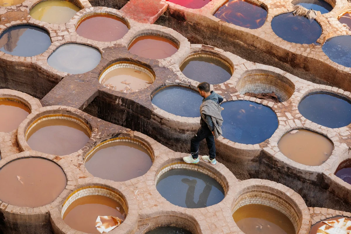 Leather hides being tanned in tannery vats, showing how leather is made
